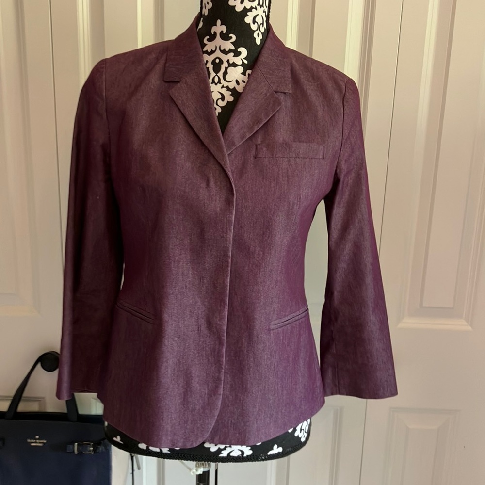 Sisley dark ourple blazer with snap front and front sewn in pockets.